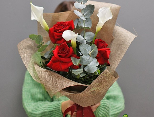 Bouquet with white calla lilies and red roses photo